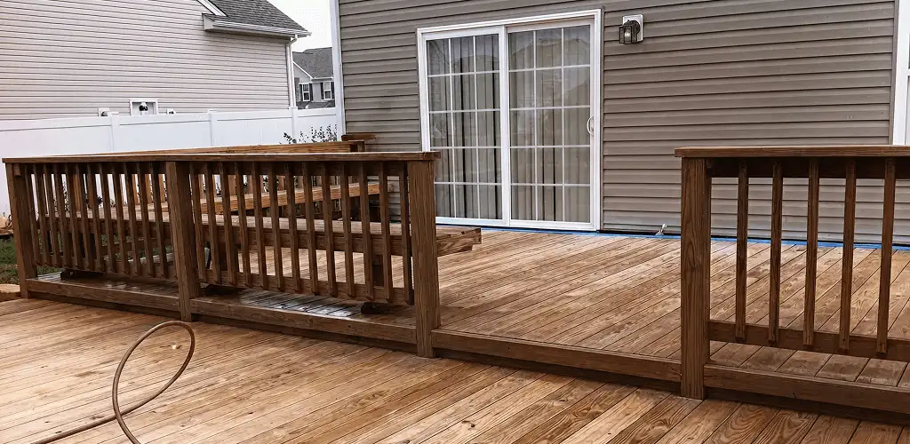 Deck sealing service protecting a backyard wood deck and railings in Knoxville, TN