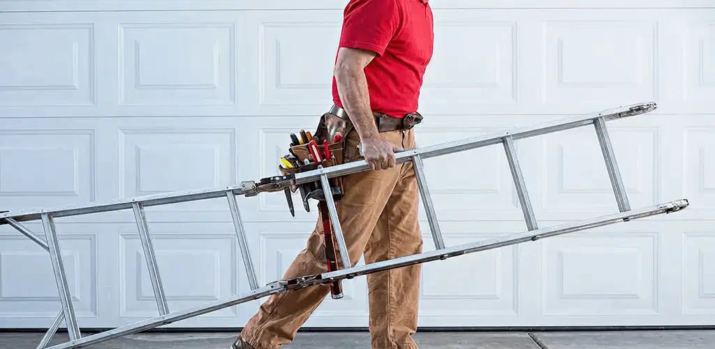 Garage door repair technician arriving with tools and ladder in Knoxville, TN