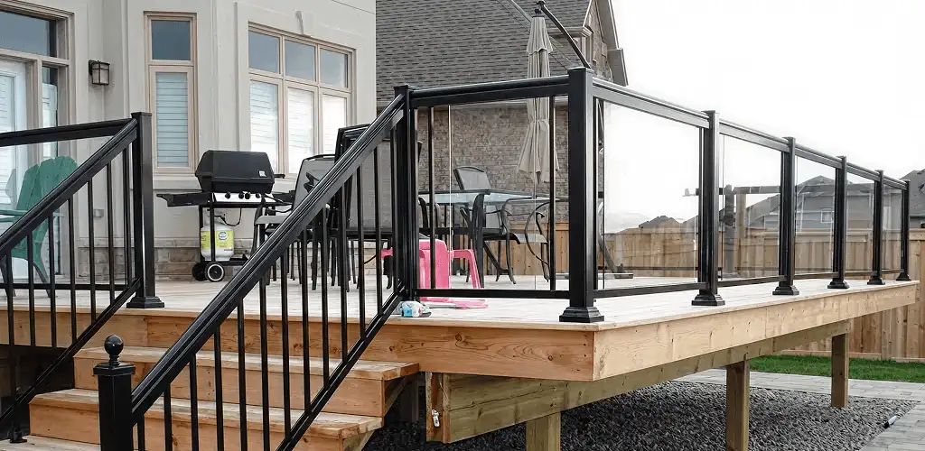 Handrail installation on a deck staircase for safety and code compliance in Knoxville, TN