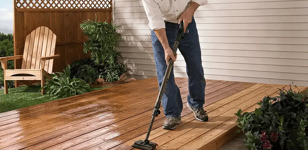 Deck staining service applying stain to a backyard wood deck in Knoxville, TN